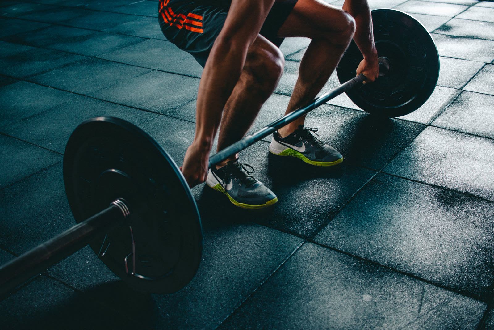 Athlete deadlifting a barbell